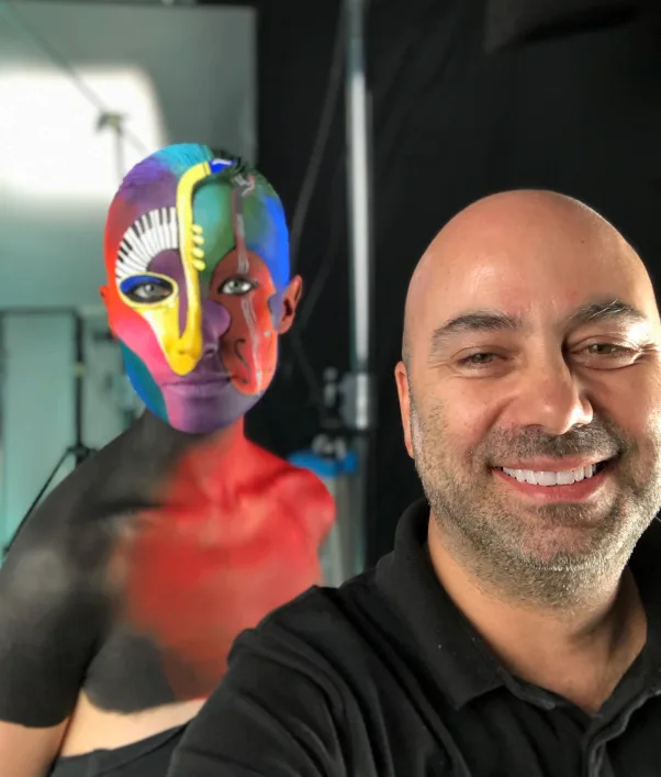 Çağrı Öztoksoy in his studio with a body-painted art model